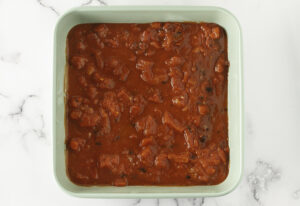 Cabbage Rolls - Line dish with tomato sauce